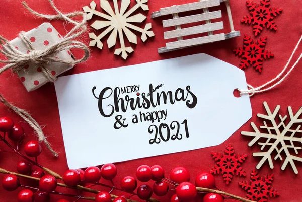 Decorazione rossa luminosa di Natale, etichetta, buon Natale e un felice 2021 — Foto Stock