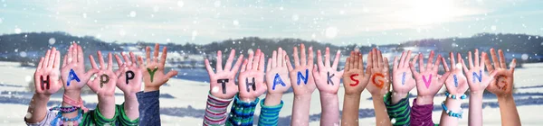 Children Hands Building Word Happy Thanksgiving, Snowy Winter Background — Stock Photo, Image