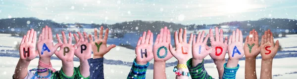 Crianças Mãos Construindo Palavra Boas Festas, Inverno nevado fundo — Fotografia de Stock