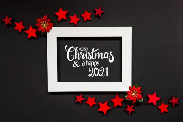 Marco, Rosa roja del invierno, estrella, texto Feliz Navidad y un feliz 2021 —  Fotos de Stock