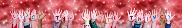 Children Hands Building Enjoy The Little Things, Red Christmas Background — Stock Photo, Image