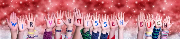 Children Hands Wir Vermissen Euch Means We Miss You, Red Christmas Background