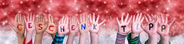 Children Hands Geschenktip Means Gift Tip, Red Christmas Background — Stock Photo, Image