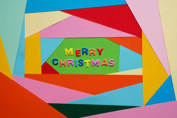Colorful Letters Building Text Merry Christmas. Colored Paper As Background — Stock Photo, Image