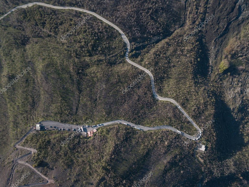 Aerial view of scenic green hill with serpentine, Italy