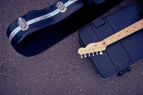 Top view of musical instruments in cases lying on street — Stock Photo