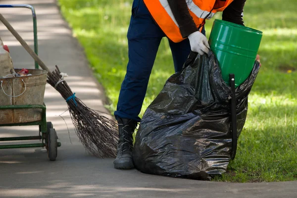 Janitor Throws Trash Urn Black Package — Stock Photo, Image