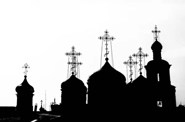 Domes and crosses of churches in black and white