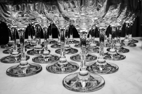 Glasses of champagne standing on the table in black and white