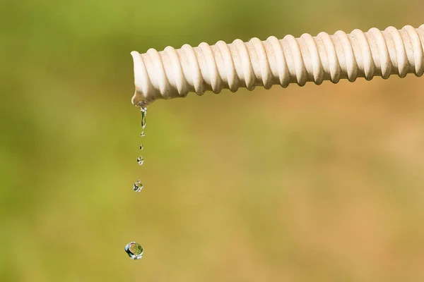 Drops Water Falling Hose Air Conditioner Background Green Grass — Stock Photo, Image