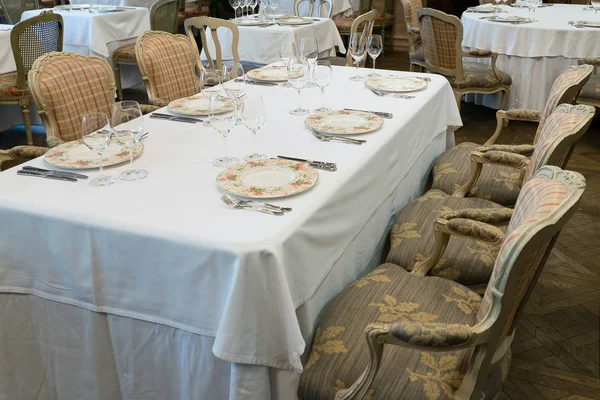 Rectangular table with white tablecloth in the restaurant