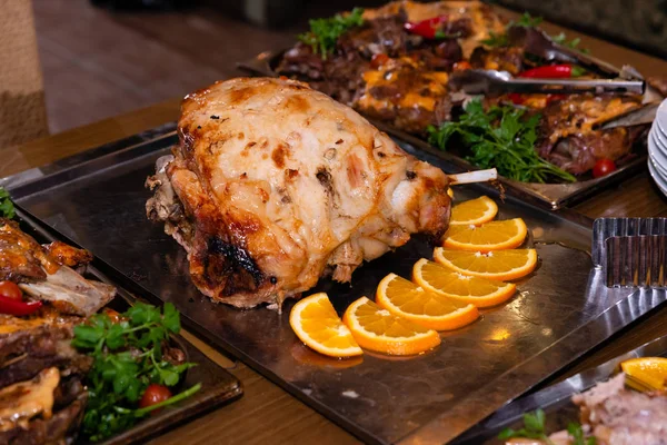 Baked pork knuckle on metal tray — Stock Photo, Image