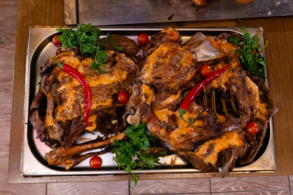 Baked meat on a metal tray — Stock Photo, Image