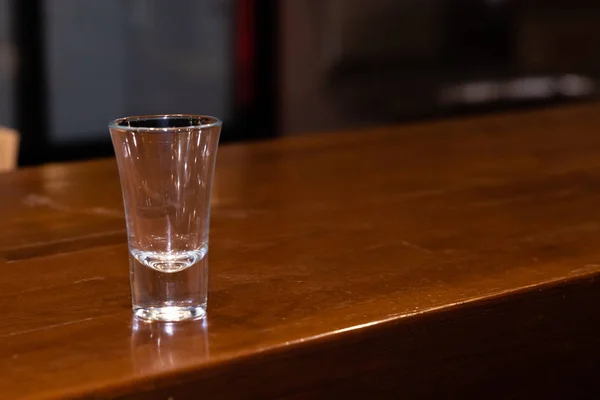 empty glass shot glass on the bar
