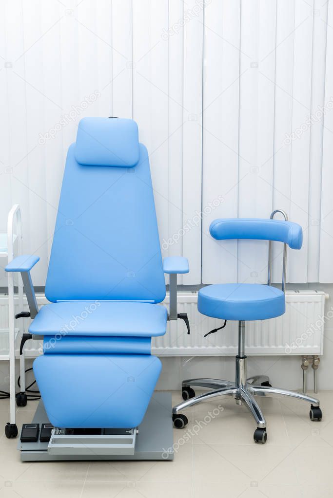 Blue medical chair for patients in the clinic