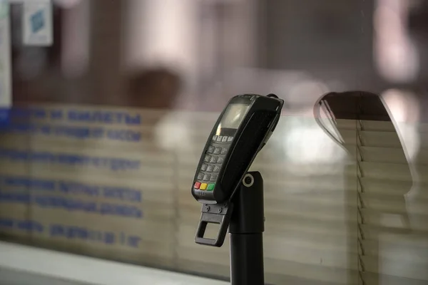 Terminal for payment with plastic cards on the counter — Stock Photo, Image