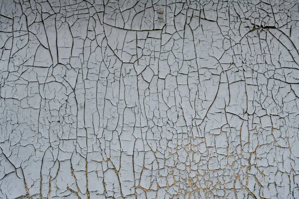 Rusty metal background with flaking, cracking blue gray paint cover.Industrial close up background . — стоковое фото