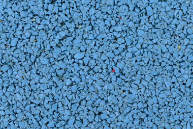 Mavi üçgenler, kauçuk ya da halı kaplamanın kaba dokusu