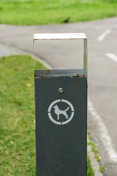 Dog waste container in a park