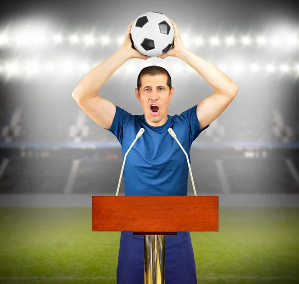 An podium with a young soccer player celebrating his victory at stadium