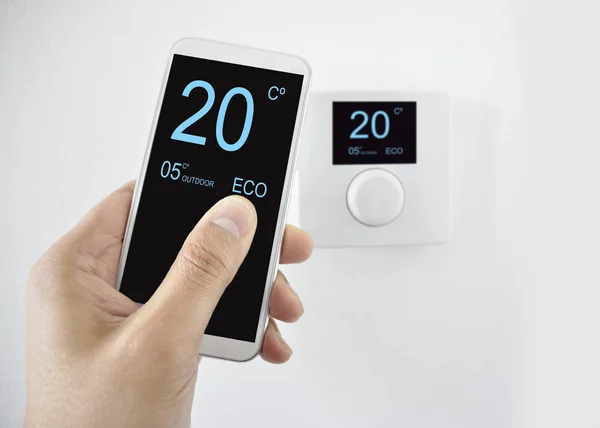 Regulating Temperature Smartphone Controlling Digital Thermostat Finger Pressing Button — Stock Photo, Image