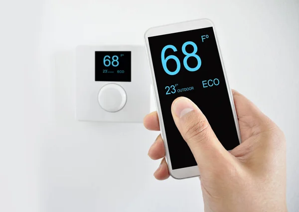 Regulating Temperature Smartphone Controlling Digital Thermostat Finger Pressing Button — Stock Photo, Image