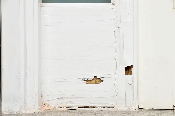 The wood door with termites damage