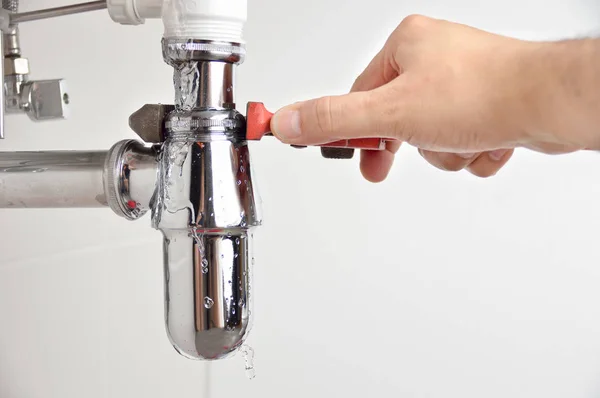 Plumber Fixing Sink Pipe Adjustable Wrench — Stock Photo, Image