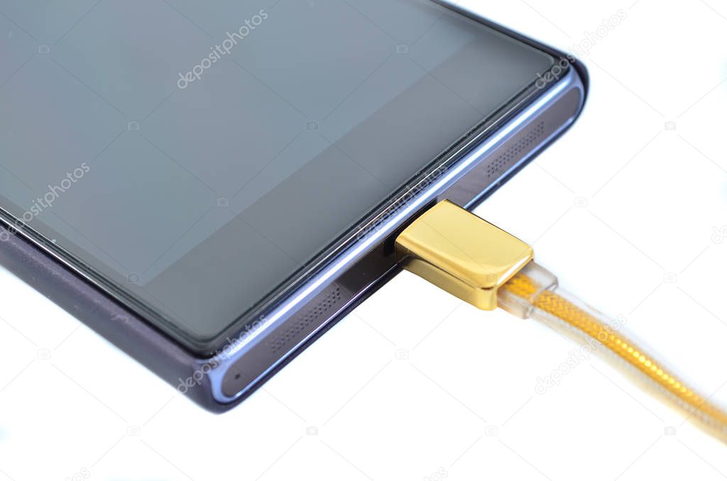 Smartphone with high speed gold usb cable isolated on white background