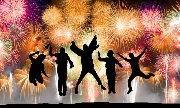 Silhouette of happy people jumping over firework, concept about having fun, success  and independence