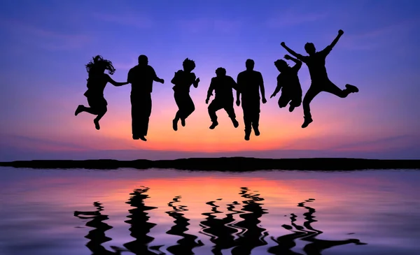 Dramatic Sky Reflections Silhouette Happy People Jumping Sunset Concept Having — Stock Photo, Image