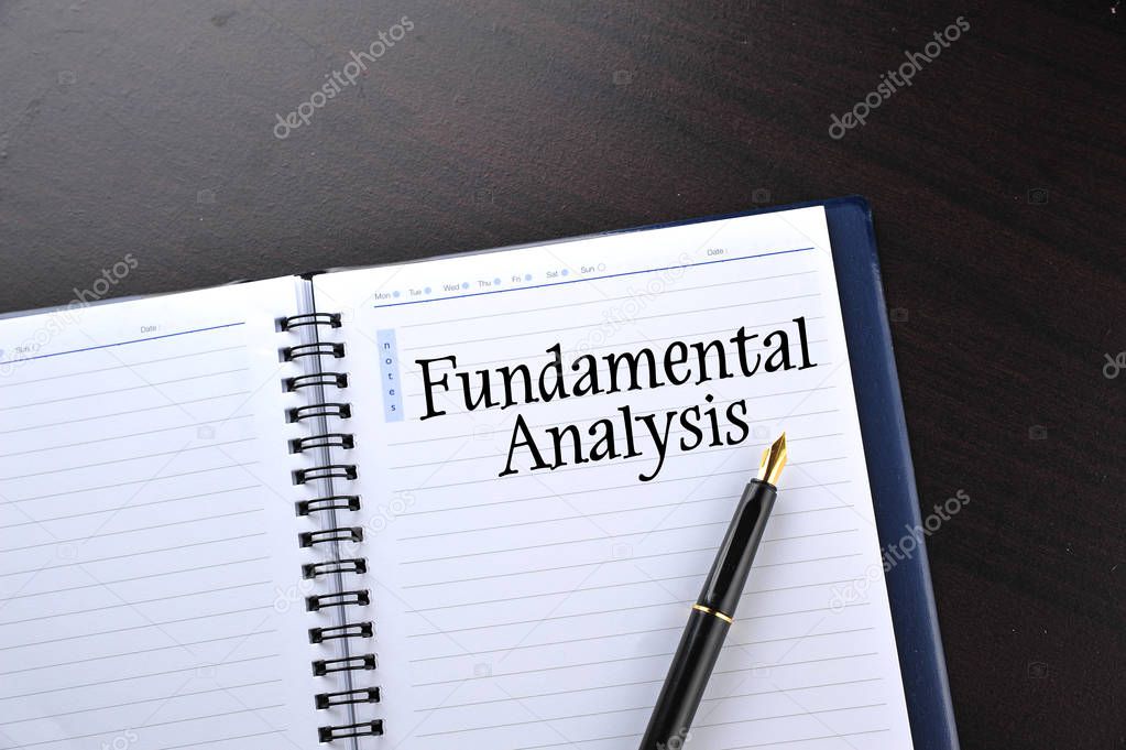 Notebook with fountain pen written word Fundamental Analysis