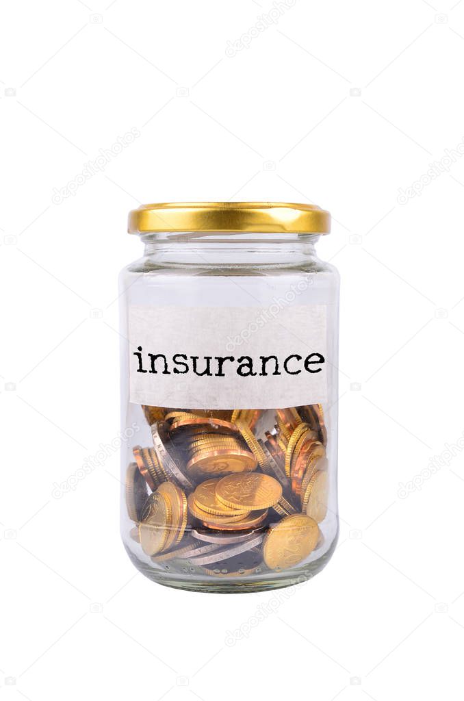Coins in bottle with label Insurance isolated on white background - financial concept