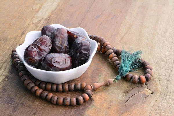 Bowl Dates Beads Wooden Table — Stock Photo, Image