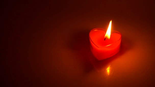 Burning Candle Heart Shape Dark Background — Stock Video