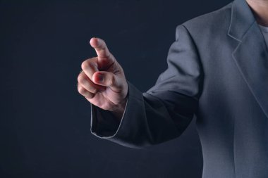 bir şey için işaret veya dokunmatik ekran dokunarak ile iş adamı