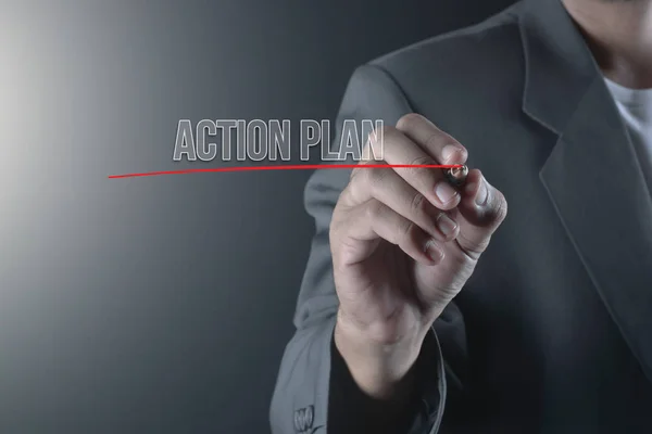 Hand of business man write or writing text ACTION PLAN — Stock Photo, Image