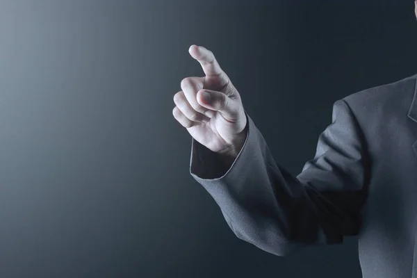 Business man with pointing to something or touching a touch scre — Stock Photo, Image