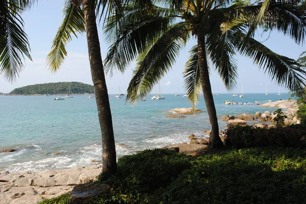 Relaxing atmosphere on Nieharn on the rock beach. Phuket