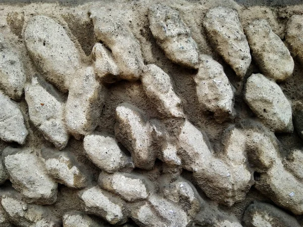 Eski taş bir bina duvarı. Ses ölçüsü taş dokusu 