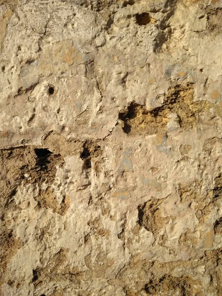 Eski taş bir bina duvarı. Ses ölçüsü taş dokusu 