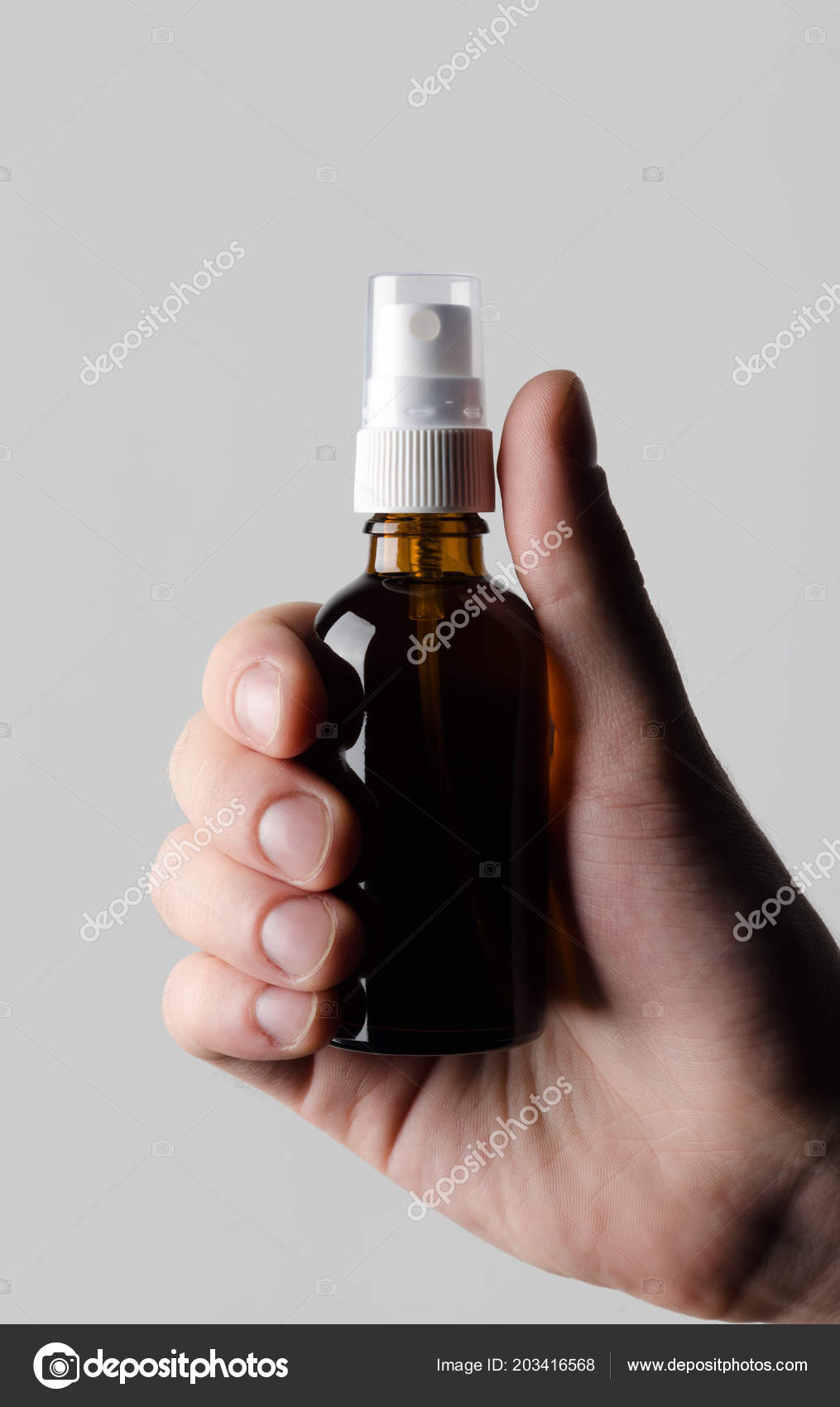 Download Amber Spray Bottle Mock Male Hands Holding Amber Spray Bottle Stock Photo Image By C Shablonstudio 203416568