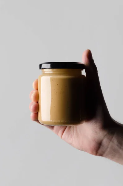 Peanut Almond Nut Butter Jar Mock Мужские Руки Держащие Банку — стоковое фото