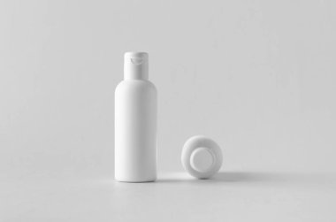 Beyaz plastik kozmetik losyonu şişesi mock-up kapaklı.