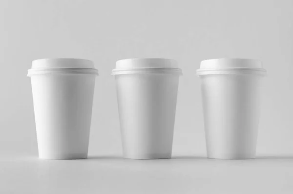12 oz. white coffee paper cup mock-up with lid.