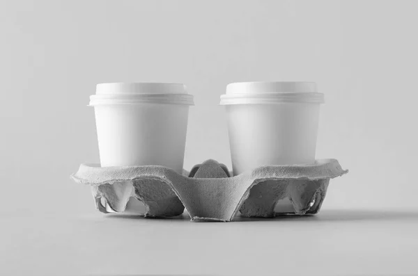 Two 8 oz. white coffee paper cups with lid in a holder. Blank Mock-Up.