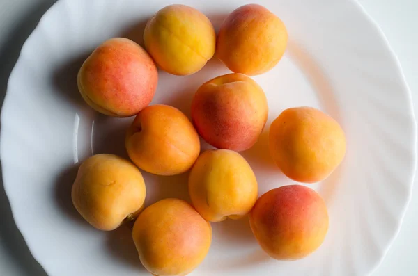 stock image Multiple Apricots on White Plate