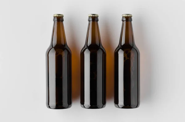 Bir bira şişesi mockup üst görünümü.