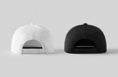 Gri arkaplanda beyaz ve siyah snapback kapakları, arka plan.