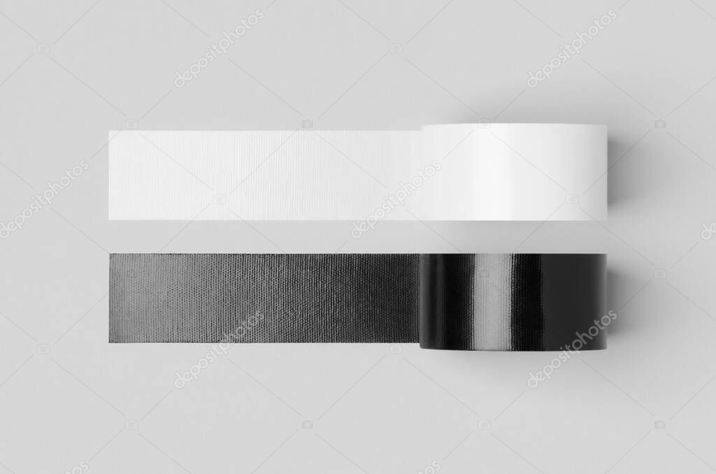 White and black unrolled duct tapes mockup on a grey background.